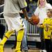 Michigan junior Tim Hardaway Jr. hands a basketball to six-year-old fan Drew Mifsud before the game against Illinois on Sunday, Feb. 24. Daniel Brenner I AnnArbor.com